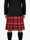 Person wearing a black jacket  and red plaid kilt on a white background