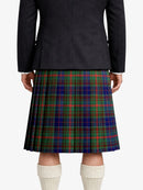 Person wearing a dark jacket and plaid kilt on a white background