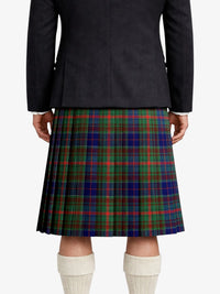 Person wearing a dark jacket and plaid kilt on a white background