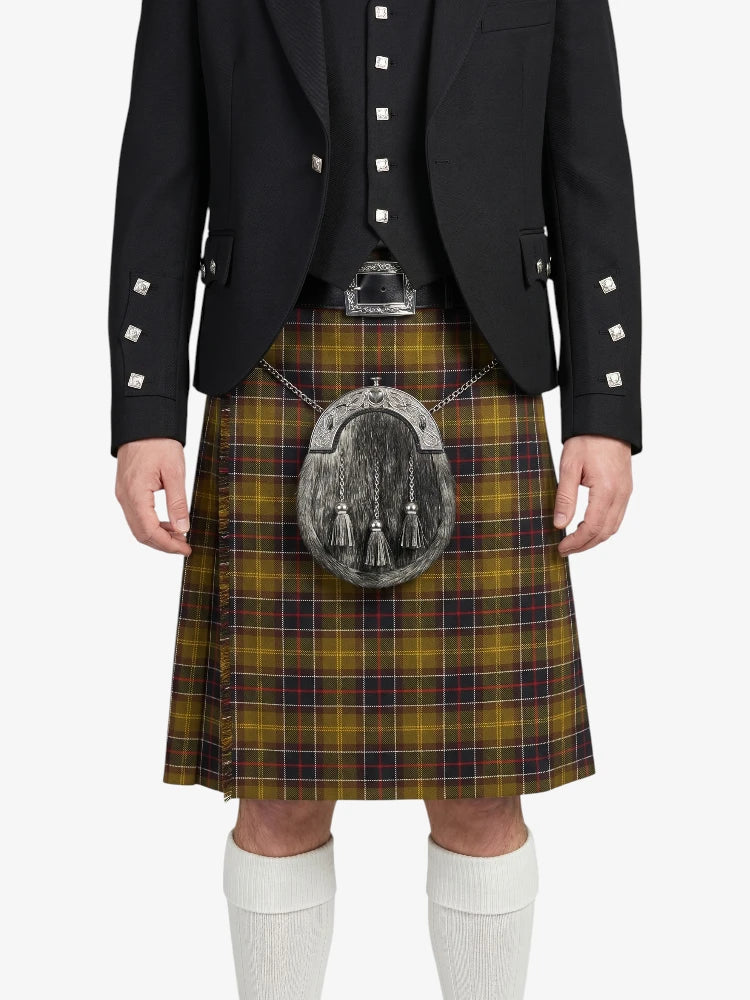 Person wearing a traditional Scottish kilt with a jacket on a white background