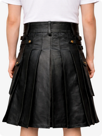 Black leather skirt worn by a person on a white background