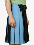 Person wearing a blue and black pleated skirt on a white background