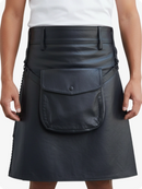 Black leather skirt worn by a person on a white background