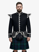 Man wearing a black highland doublet dress with white trim