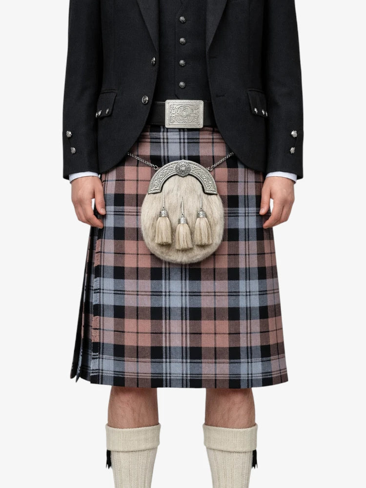 Person wearing a traditional Scottish kilt with a sporran on a white background