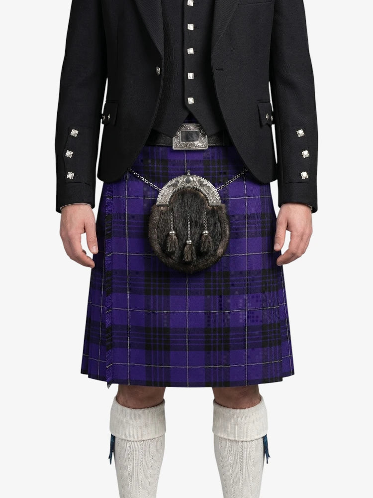 Person wearing a black jacket, purple plaid kilt, and white knee-high socks on a white background