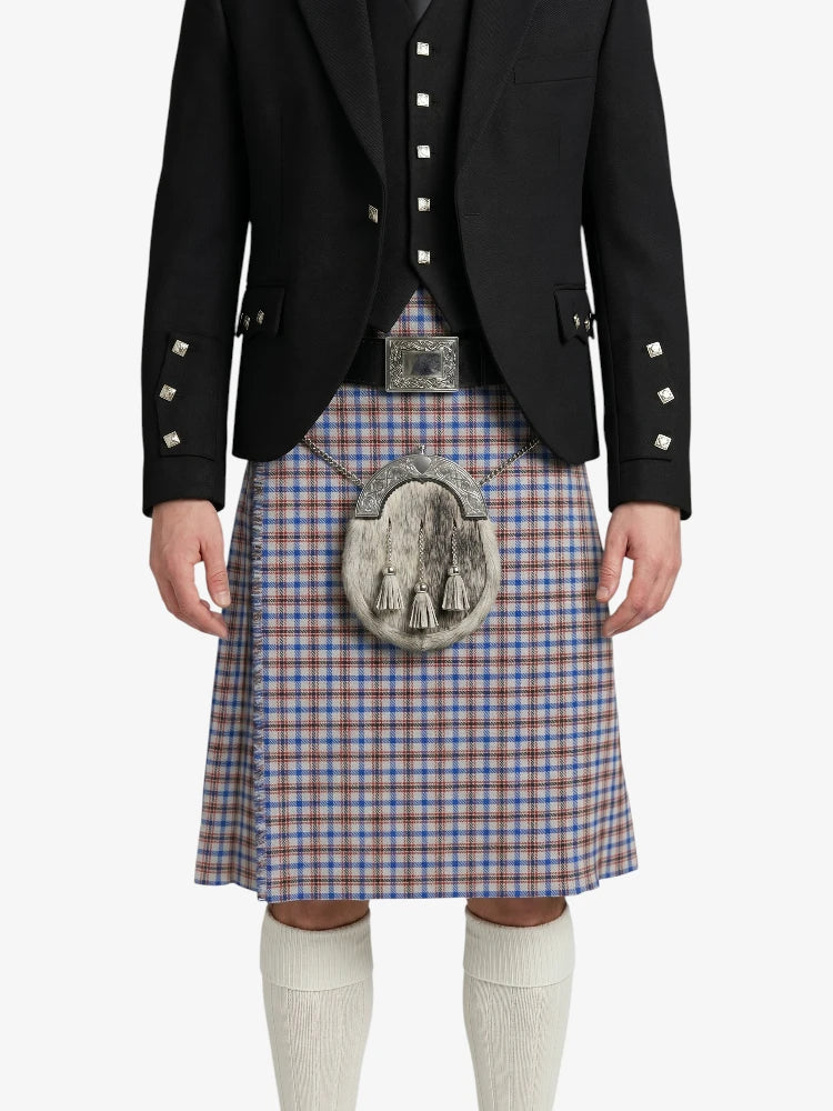 Person wearing a traditional Scottish kilt with a decorative buckle on a white background