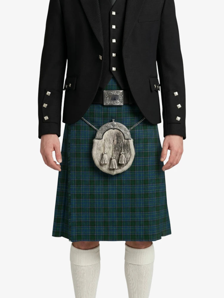 Person wearing a traditional Scottish kilt with a jacket on a white background