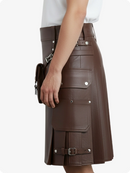 Brown leather skirt with silver buckles on a white background