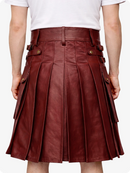 Burgundy leather skirt worn by a person on a white background