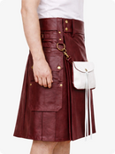 Burgundy leather kilt with gold buttons and a white bag on a white background