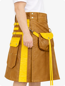 Camel and yellow kilt with visible buttons on a white background