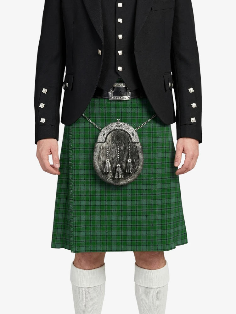 Person wearing a green plaid kilt with a black jacket on a white background