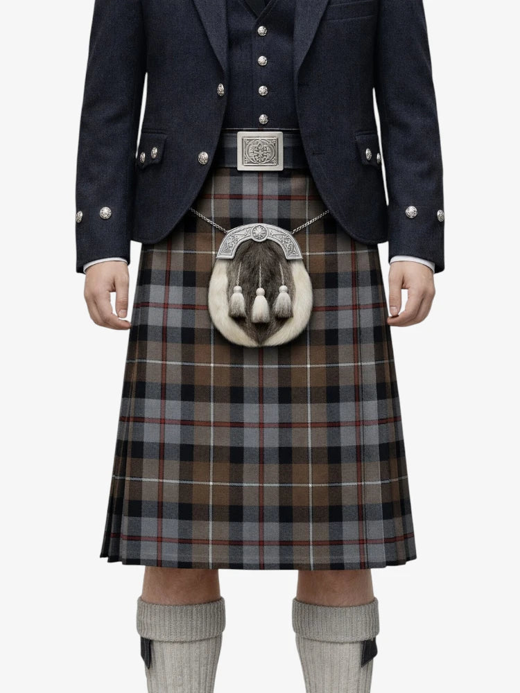 Traditional Scottish kilt with a dark jacket and white belt on a white background