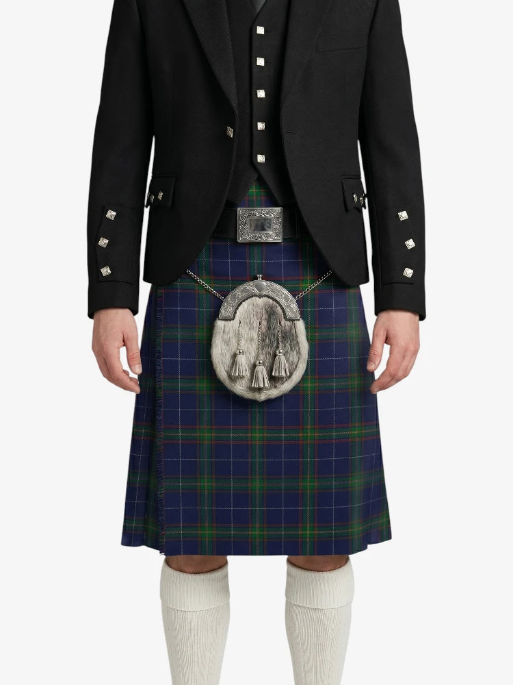 Person wearing a traditional Scottish kilt with a jacket on a white background