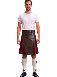 A man modeling a dark brown faux-leather kilt with red side panels, paired with a white t-shirt, white knee-high socks, and black lace-up shoes, against a plain white background.