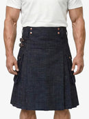 Man wearing a navy denim kilt on a white background