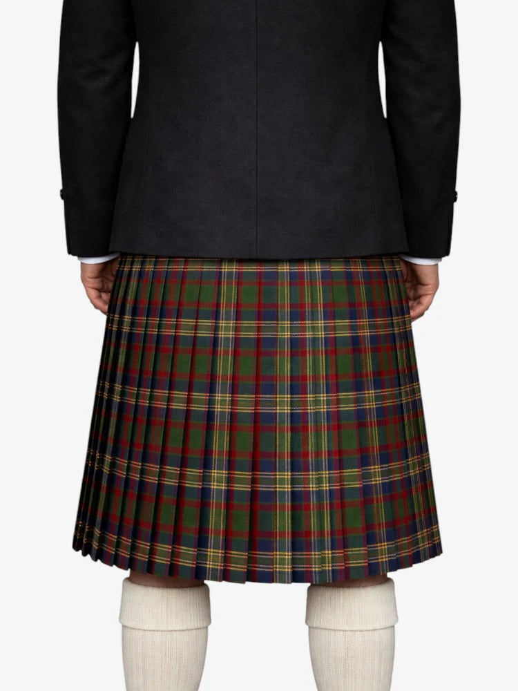 Person wearing a black jacket and plaid kilt on a white background