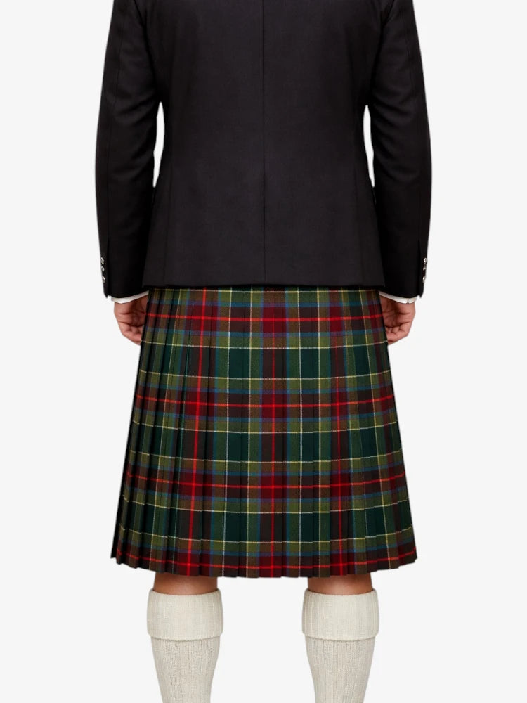 Person wearing a black jacket and green plaid kilt on a white background