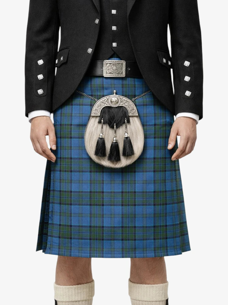 Person wearing a traditional Scottish kilt with a jacket and sporran on a white background