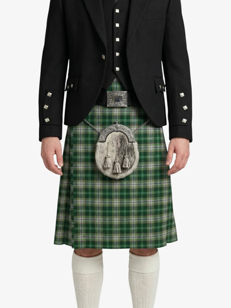 Person wearing a green plaid kilt with a black jacket on a white background