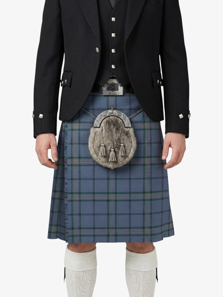 Person wearing a traditional Scottish kilt with a jacket and white knee-high socks on a white background