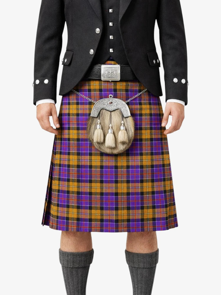 Person wearing a traditional Scottish kilt with a tartan pattern on a white background