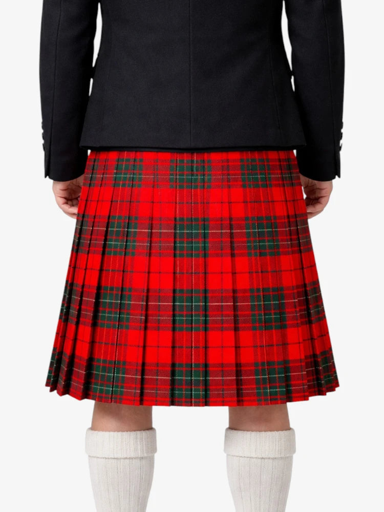 Person wearing a red plaid kilt with a black top on a white background
