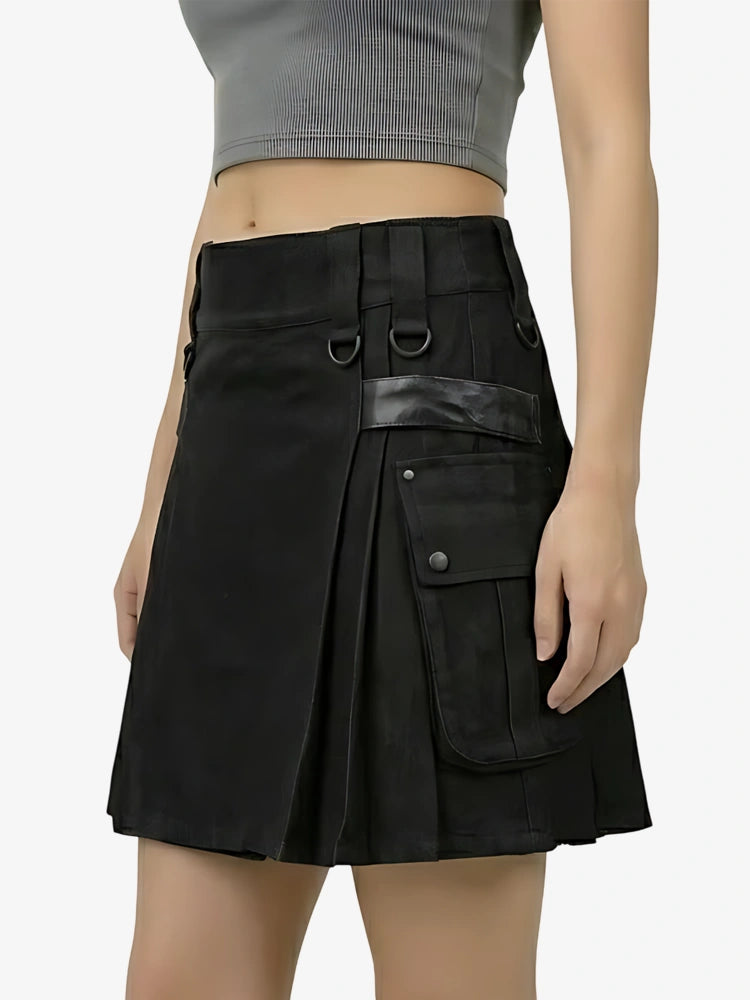 Black skirt with leather accents worn by a person on a plain background
