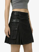 Black skirt with leather accents worn by a person on a white background