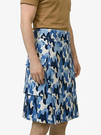Blue camouflage skirt worn by a person on a white background