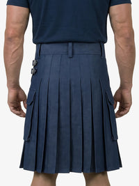 Person wearing a navy pleated kilt on a white background