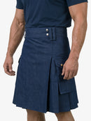 Man wearing a navy blue kilt on a white background