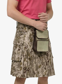 Person wearing a camouflage kilt holding a green bag on a white background