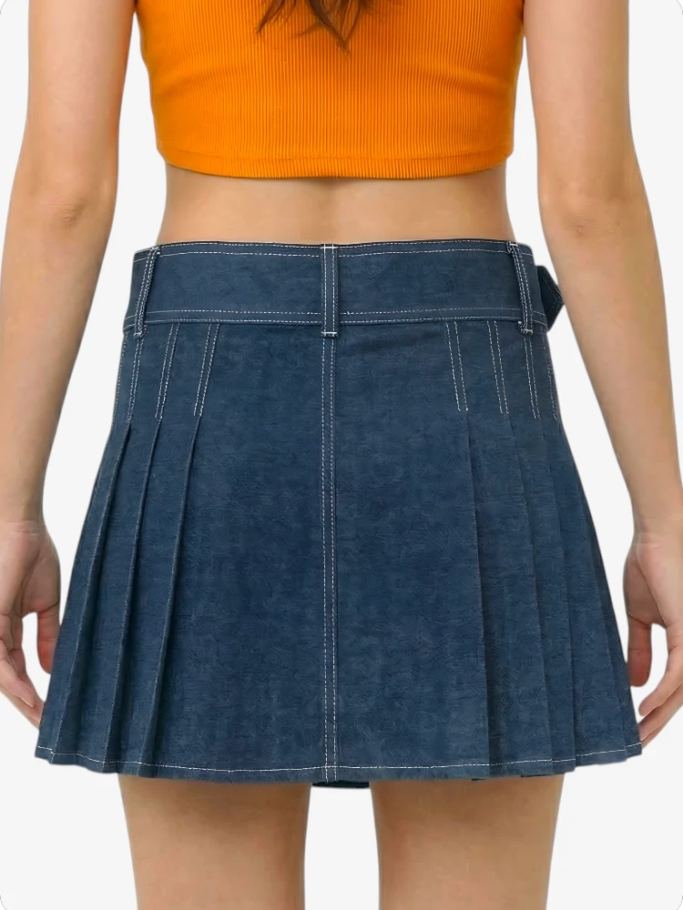 Blue pleated skirt worn by a person on a white background