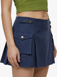 Navy blue skirt with a gold button on a white background