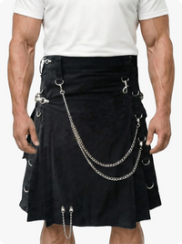 Black kilt with silver chains and hooks worn by a person on a white background