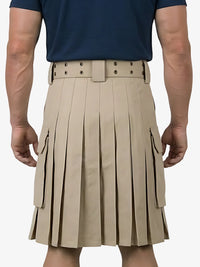 Person wearing a beige pleated kilt with a belt on a white background