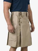 Beige kilt worn by a person on a white background