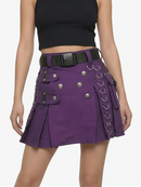 Person wearing a black top and purple skirt with button details on a white background