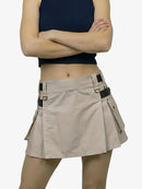 Beige skirt worn by a person on a white background