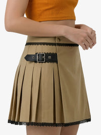 Beige pleated skirt with black lace trim and belt on a white background