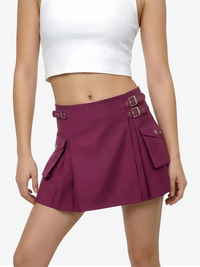 Purple skirt with belt and white top on a plain background