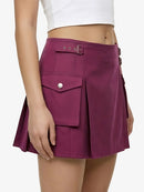 Purple skirt with a white top on a plain background