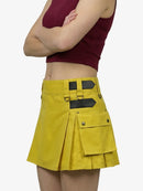 Yellow skirt with black accents worn by a person on a white background