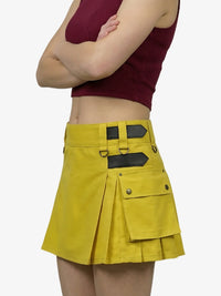 Yellow skirt with black accents worn by a person on a white background