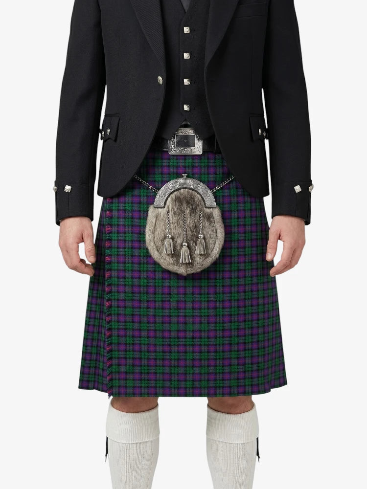 Person wearing a traditional Scottish kilt with a tartan pattern on a white background