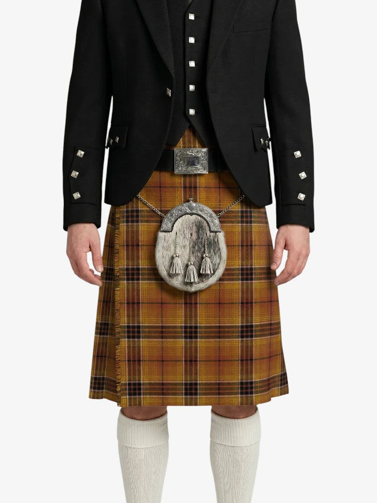 Person wearing a traditional Scottish kilt with a black jacket on a white background