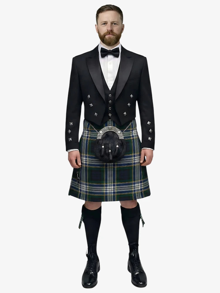 Man wearing a traditional Scottish dress gordon tartan kilt with a black prince charlie jacket and bow tie on a white background