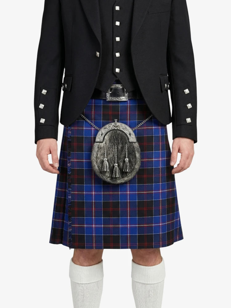 Person wearing a black jacket and blue plaid kilt on a white background